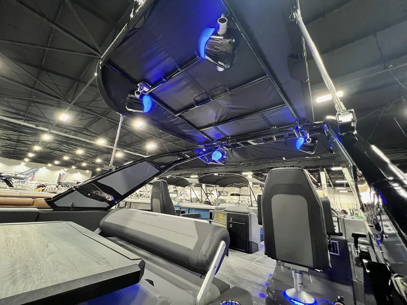 Slide: The Image of Interior of 2024 Berkshire 25ULE Roswell Arch STS Tritoon with blue LED lighting. - 44