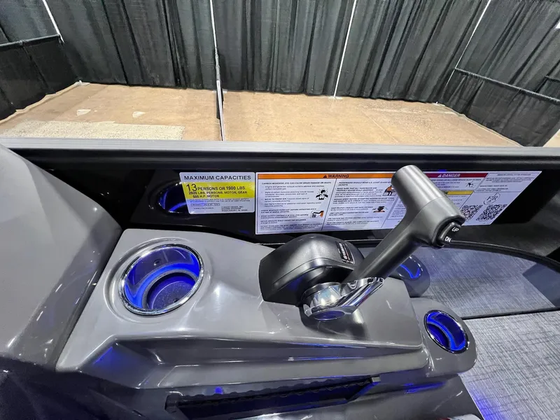 Slide: The Image of Control panel of the 2024 Berkshire 25ULE Roswell Arch STS Tritoon with cup holders. - 46