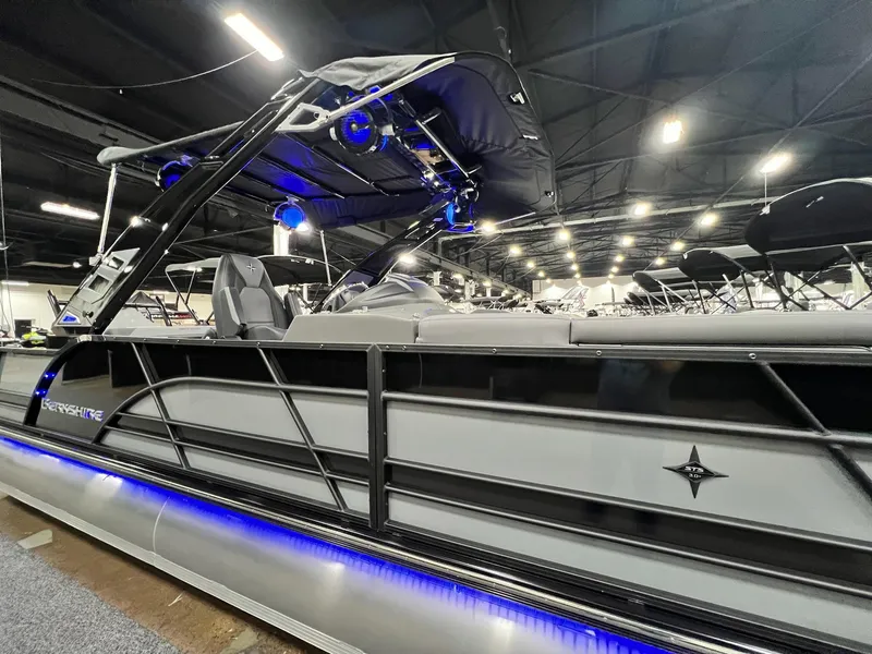 Slide: The Image of 2024 Berkshire 25ULE Roswell Arch STS Tritoon with blue LED lights in showroom. - 49