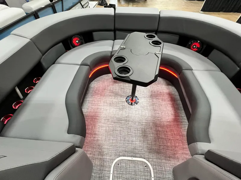 Slide: The Image of Luxurious seating area of the 2024 Berkshire 25ULE Roswell Arch STS Tritoon with ambient lighting. - 5