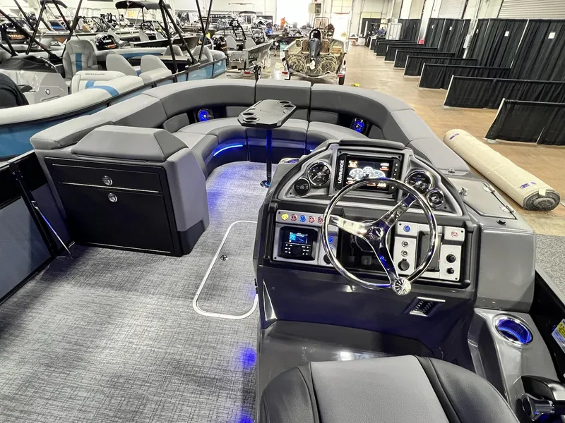 Slide: The Image of 2024 Berkshire 25ULE Roswell Arch STS Tritoon interior with modern helm and seating. - 9