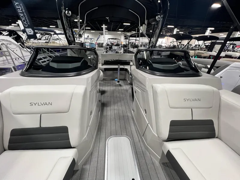 Slide: The Image of 2024 Sylvan G5 CLZ DC Arch Tritoon interior with sleek seating and modern design. - 11