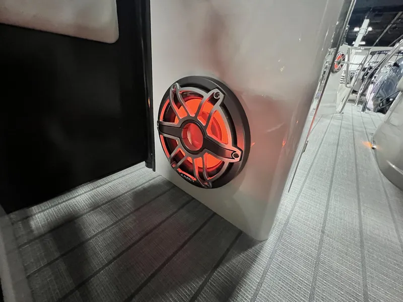 Slide: The Image of 2024 Sylvan G5 CLZ DC Arch Tritoon with illuminated speaker detail. - 12