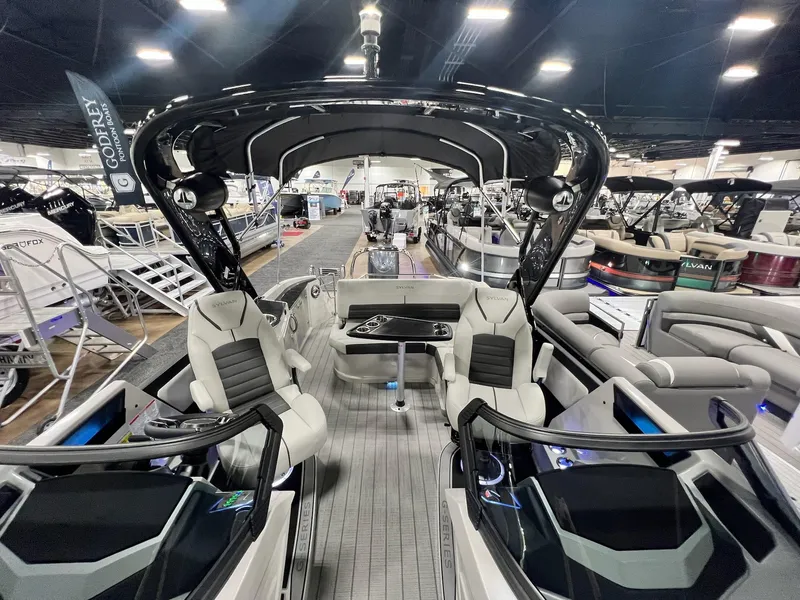Slide: The Image of 2024 Sylvan G5 CLZ DC Arch Tritoon interior at a boat show. - 16