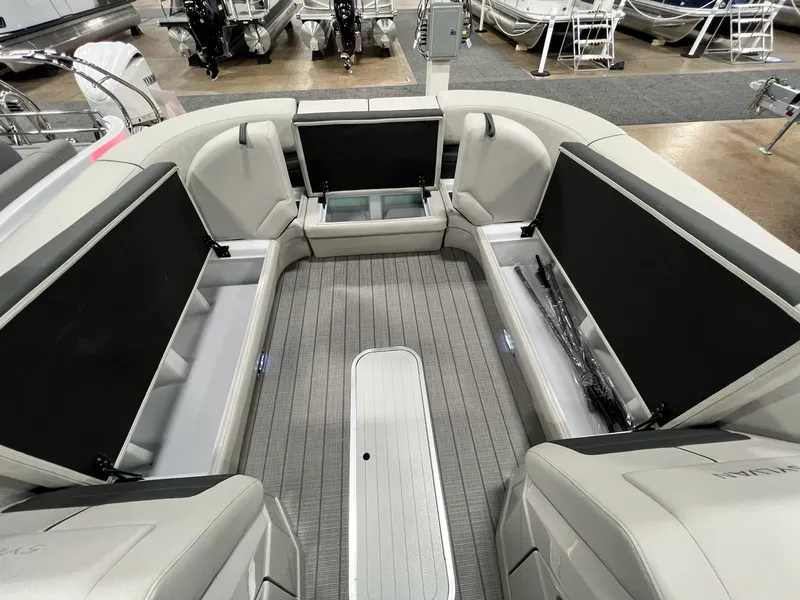 Slide: The Image of 2024 Sylvan G5 CLZ DC Arch Tritoon interior with open storage compartments. - 32