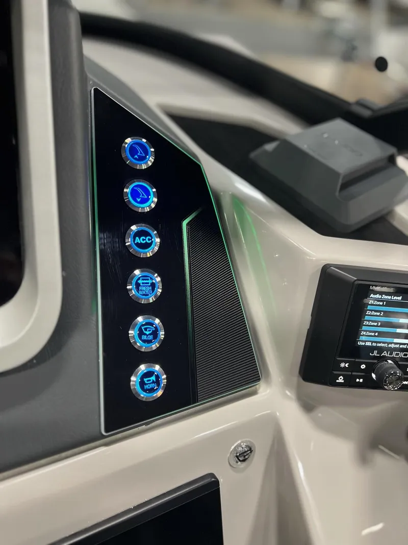 Slide: The Image of Control panel of 2024 Sylvan G5 CLZ DC Arch Tritoon with illuminated buttons. - 34