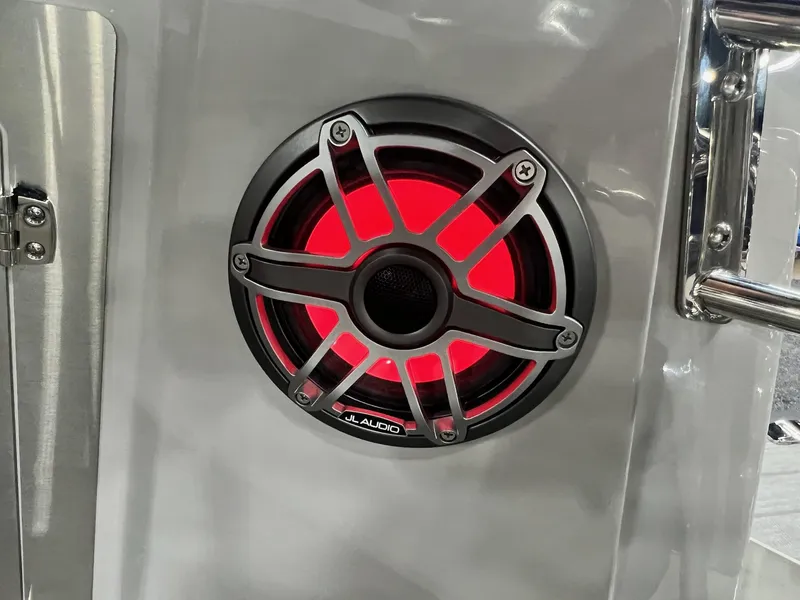 Slide: The Image of Close-up of JL Audio speaker with red LED light on 2024 Sylvan G5 CLZ DC Arch Tritoon. - 36