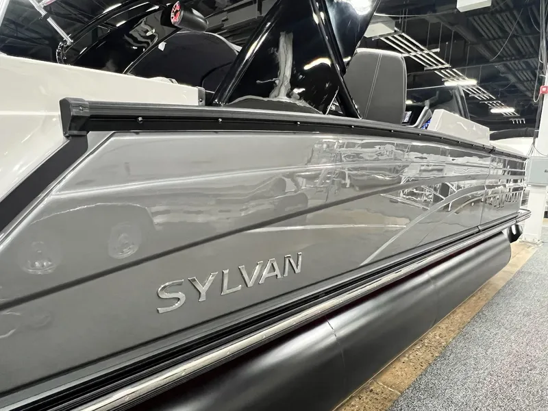 Slide: The Image of 2024 Sylvan G5 CLZ DC Arch Tritoon boat side view in showroom. - 38