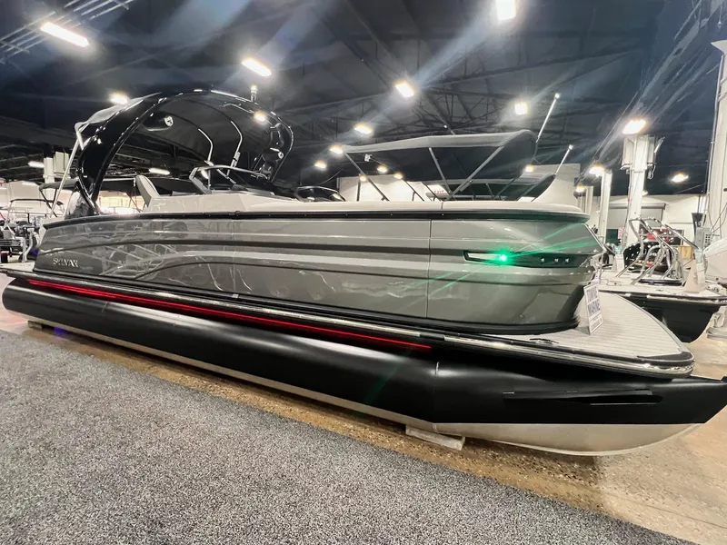 Slide: The Image of 2024 Sylvan G5 CLZ DC Arch Tritoon boat on display indoors. - 42