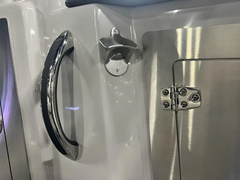 Slide: The Image of Close-up of 2024 Sylvan G5 CLZ DC Arch Tritoon's stainless steel handle and hinge. - 46