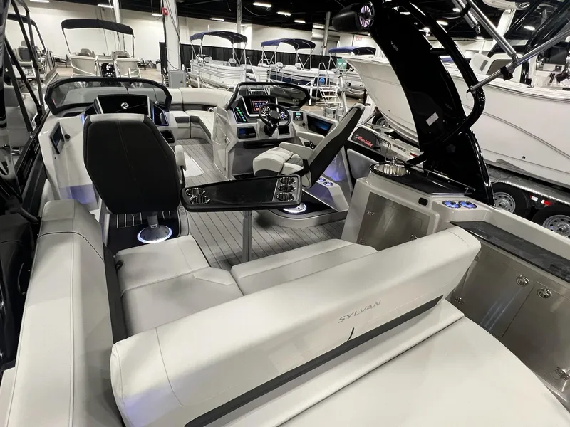 Slide: The Image of 2024 Sylvan G5 CLZ DC Arch Tritoon interior with modern seating and advanced dashboard. - 49