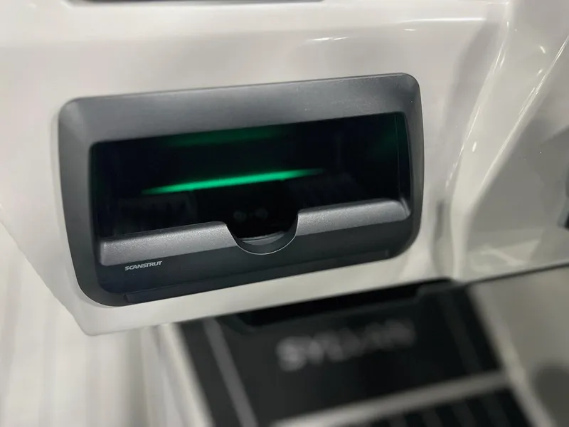 Slide: The Image of Close-up of 2024 Sylvan G5 CLZ DC Arch Tritoon dashboard compartment. - 6