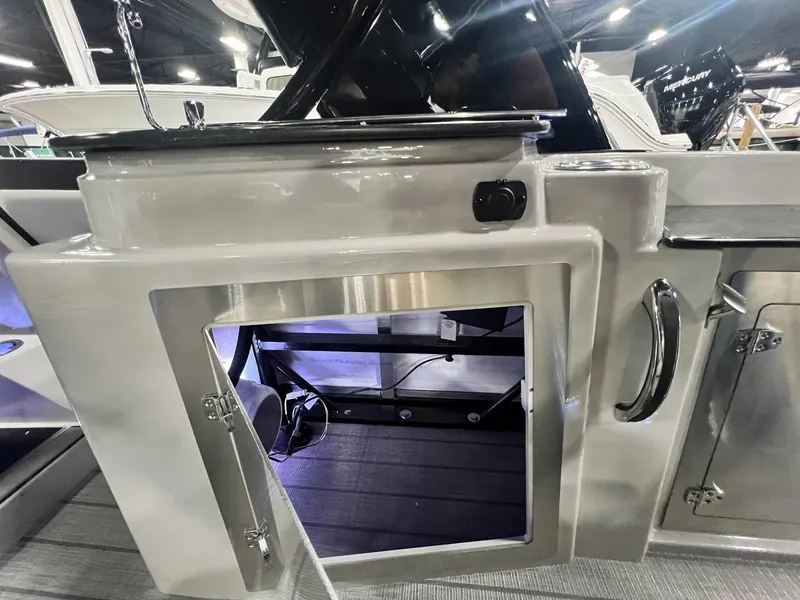 Slide: The Image of 2024 Sylvan G5 CLZ DC Arch Tritoon interior storage compartment with sleek design and modern features. - 9