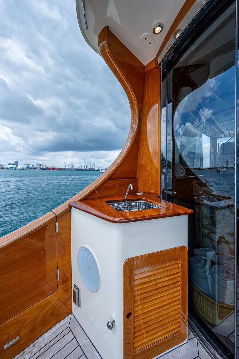 Slide: The Image of 2018 Hinckley Talaria 55 MKII MY yacht with elegant wood finish and ocean view. - 10