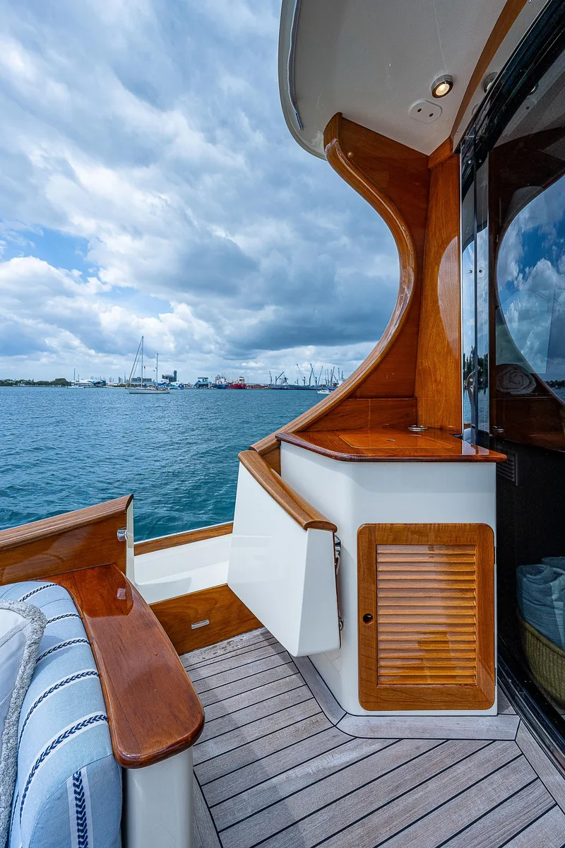 Slide: The Image of 2018 Hinckley Talaria 55 MKII MY yacht deck with ocean view and elegant wood finish. - 11