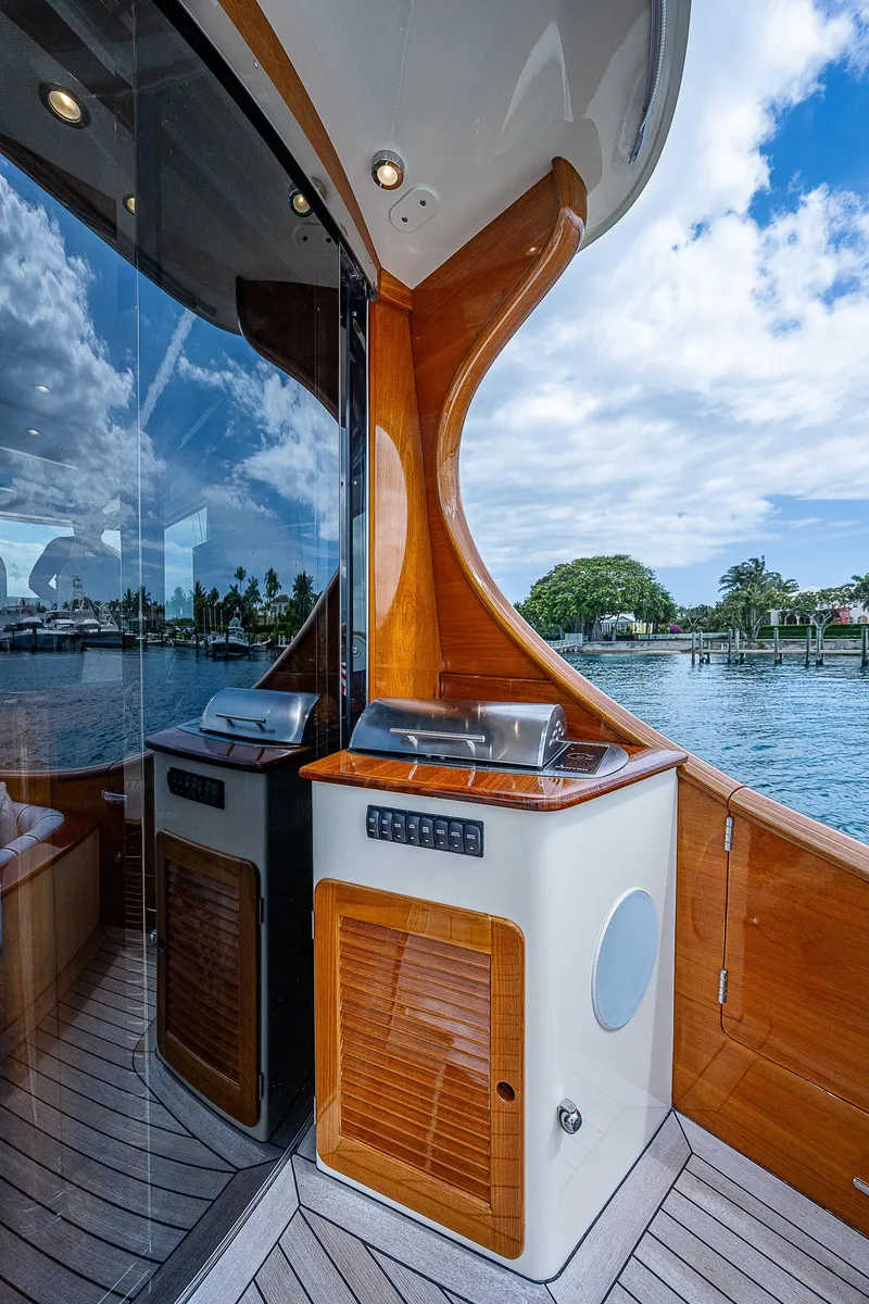 Slide: The Image of 2018 Hinckley Talaria 55 MKII MY yacht with elegant woodwork and outdoor grill. - 13
