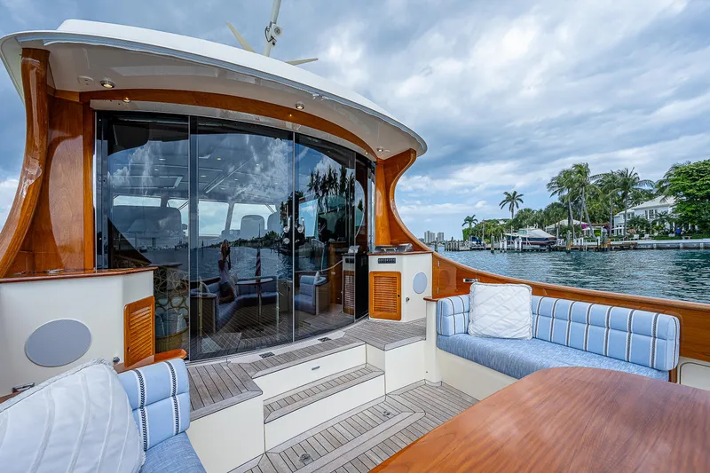 Slide: The Image of Luxurious 2018 Hinckley Talaria 55 MKII MY yacht with elegant seating and waterfront view. - 14