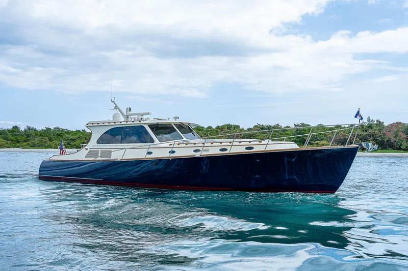 Slide: The Image of 2018 Hinckley Talaria 55 MKII MY yacht cruising on calm waters. - 2