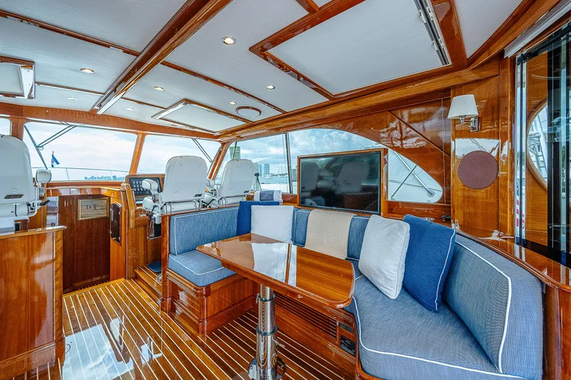 Slide: The Image of Luxurious 2018 Hinckley Talaria 55 MKII MY yacht interior with elegant wood finish and plush seating. - 21