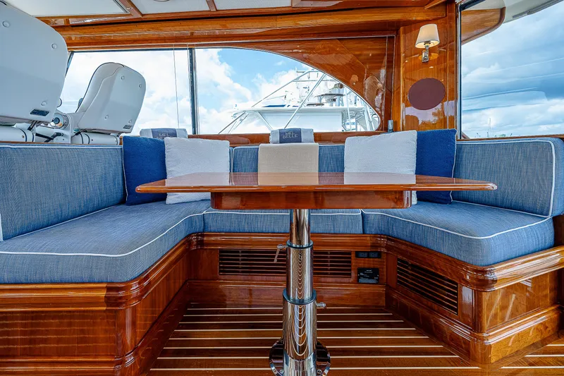 Slide: The Image of Luxurious interior of 2018 Hinckley Talaria 55 MKII MY yacht with elegant wood and blue seating. - 22