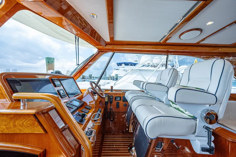 Slide: The Image of Luxurious 2018 Hinckley Talaria 55 MKII MY yacht interior with elegant wood and leather seating. - 24