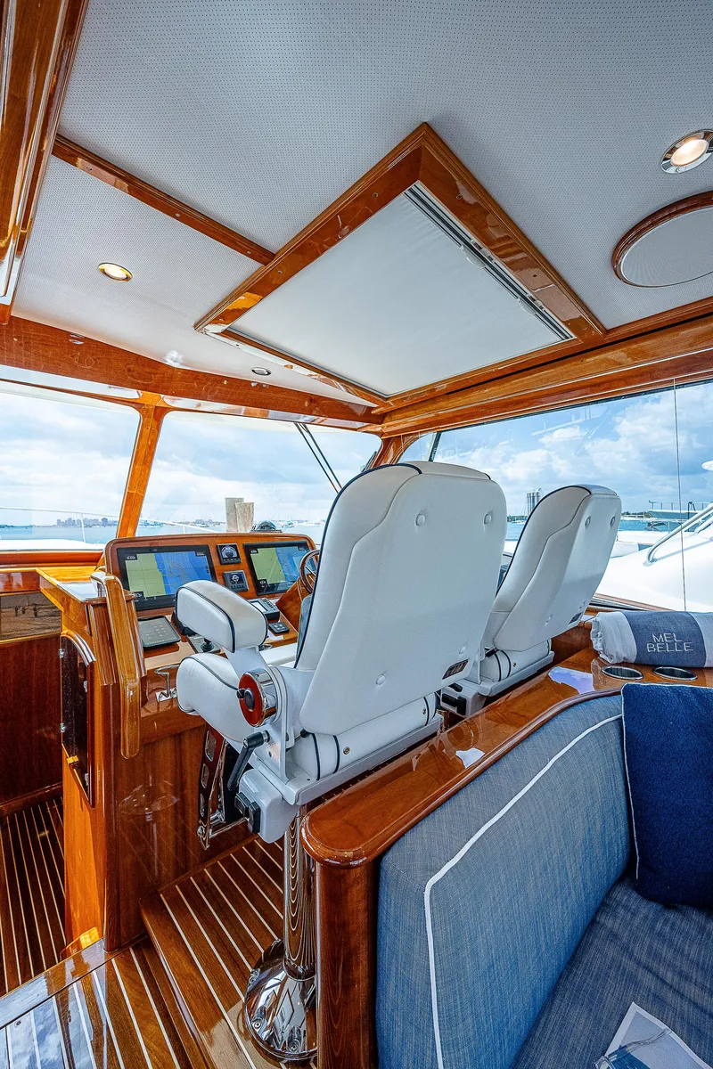 Slide: The Image of Luxurious 2018 Hinckley Talaria 55 MKII MY yacht interior with elegant seating and navigation controls. - 26