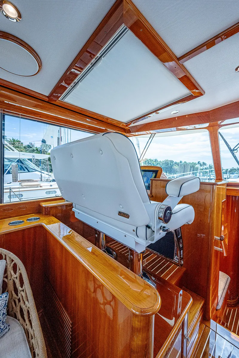 Slide: The Image of 2018 Hinckley Talaria 55 MKII MY yacht interior with polished wood and modern helm station. - 31