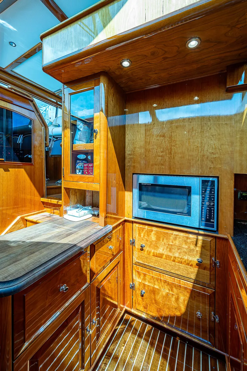 Slide: The Image of Luxurious wooden interior of 2018 Hinckley Talaria 55 MKII MY yacht kitchen. - 37