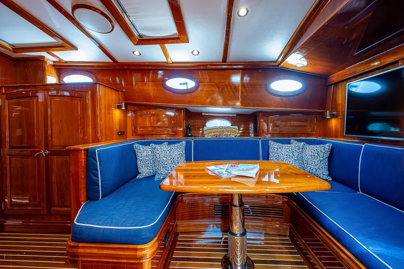 Slide: The Image of Luxurious interior of 2018 Hinckley Talaria 55 MKII MY yacht with blue seating and wooden finishes. - 39