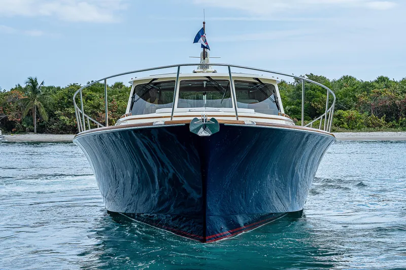 Slide: The Image of 2018 Hinckley Talaria 55 MKII MY yacht on water, front view with lush greenery background. - 4