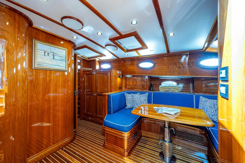 Slide: The Image of Luxurious 2018 Hinckley Talaria 55 MKII MY yacht interior with elegant wood finish and blue seating. - 41