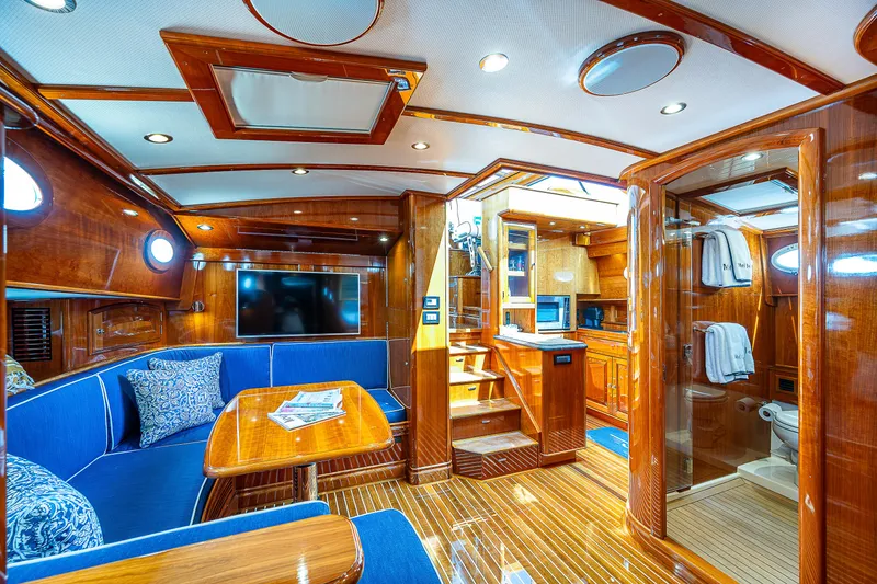 Slide: The Image of Luxurious interior of 2018 Hinckley Talaria 55 MKII MY yacht with wood finishes and blue seating. - 44