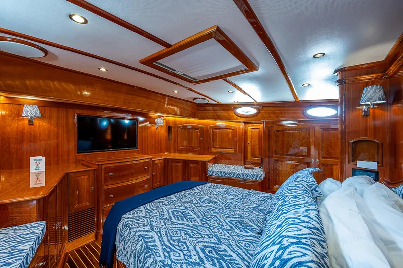 Slide: The Image of Luxurious 2018 Hinckley Talaria 55 MKII MY yacht interior with wood finish and patterned bedding. - 47