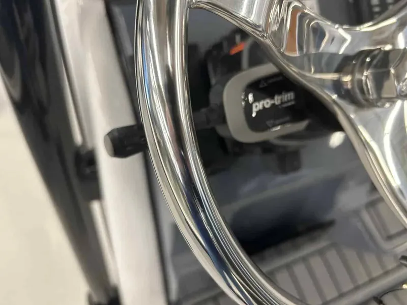 Slide: The Image of Close-up of 2024 Tidewater 2300 Carolina Bay steering wheel and controls. - 11