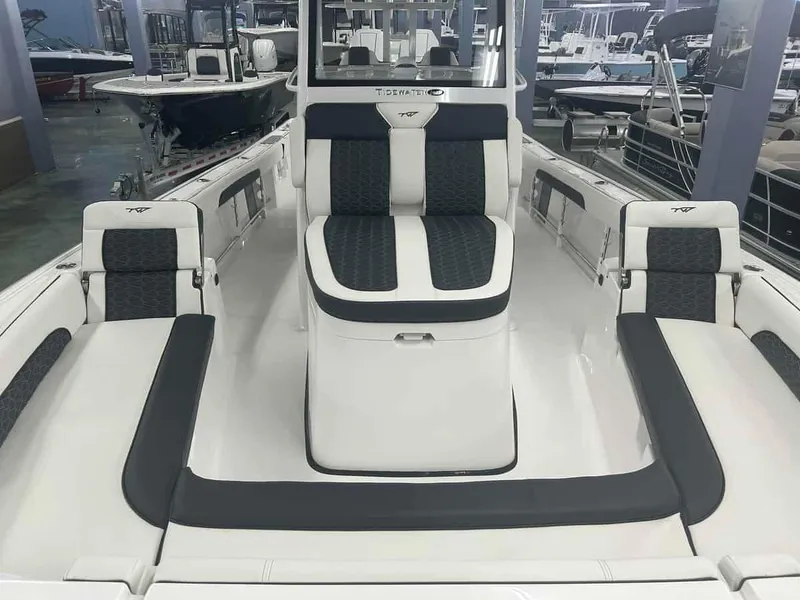Slide: The Image of 2024 Tidewater 2300 Carolina Bay boat interior with cushioned seating and sleek design. - 4