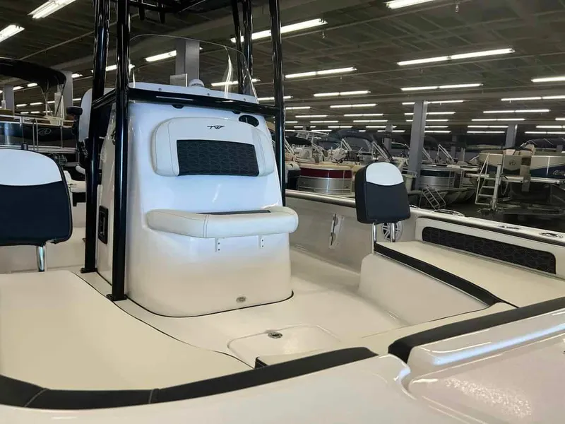 Slide: The Image of 2024 Tidewater 2300 Carolina Bay boat interior in showroom setting. - 5