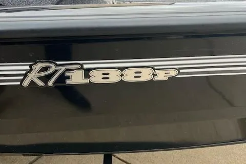 Slide: The Image of 2024 Ranger RT188P boat model logo on black exterior. - 19
