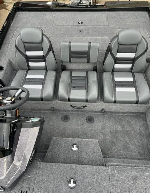 Slide: The Image of 2024 Ranger RT188P boat interior with three gray and black cushioned seats. - 3