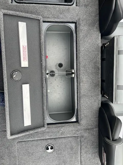 Slide: The Image of 2024 Ranger RT188P boat storage compartment with open lid. - 6