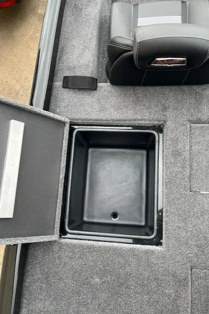 Slide: The Image of 2024 Ranger RT188P boat storage compartment with open lid and seat. - 9