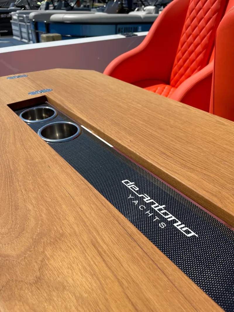 Slide: The Image of De Antonio Yachts D 28 2020 model with wooden table and red seats. - 18