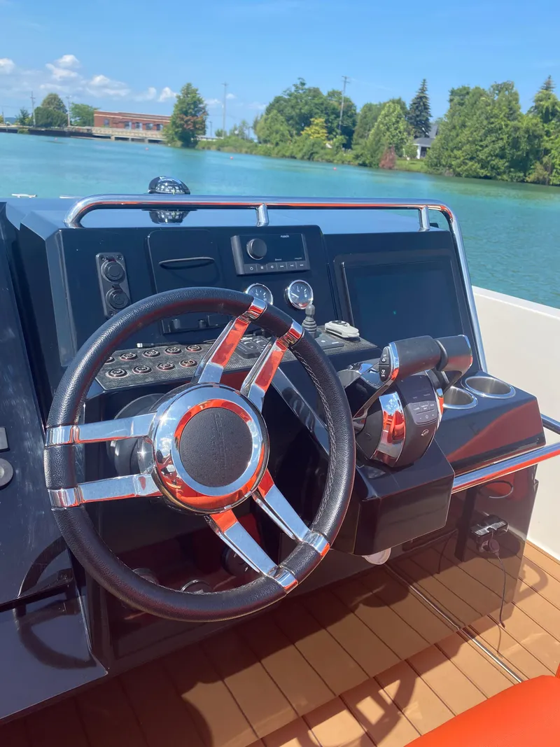 Slide: The Image of Steering console of 2020 De Antonio Yachts D 28 on a sunny day. - 26