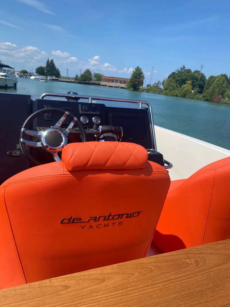Slide: The Image of 2020 De Antonio Yachts D 28 with orange seats and steering wheel on a sunny day. - 27