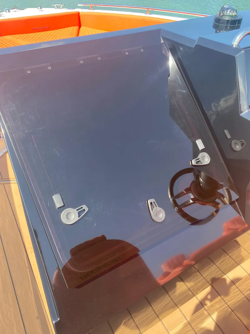 Slide: The Image of 2020 De Antonio Yachts D 28 helm station with modern controls and sleek design. - 28