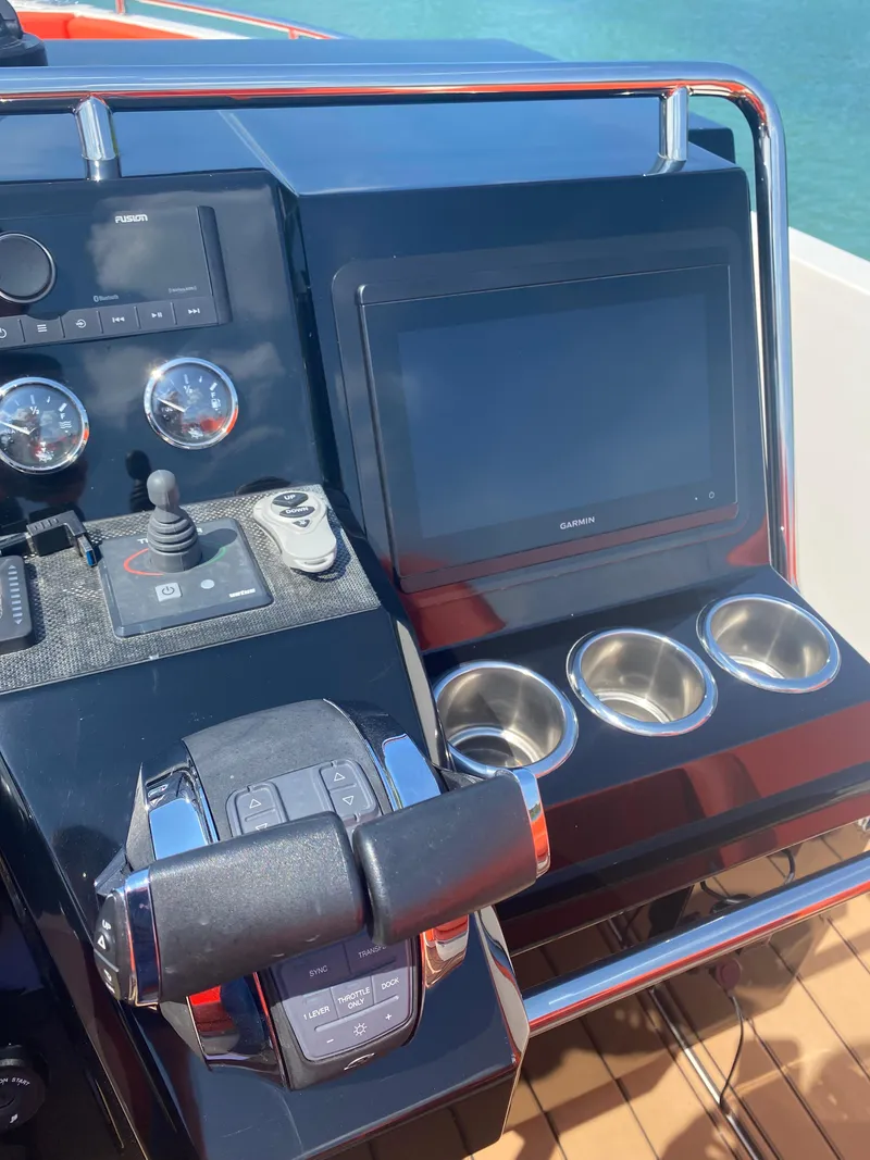 Slide: The Image of Control panel of a 2020 De Antonio Yachts D 28 with navigation screen and cup holders. - 33