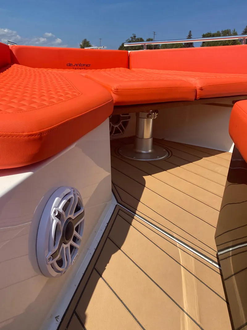 Slide: The Image of De Antonio Yachts D 28 2020 model with orange seating and teak deck. - 36