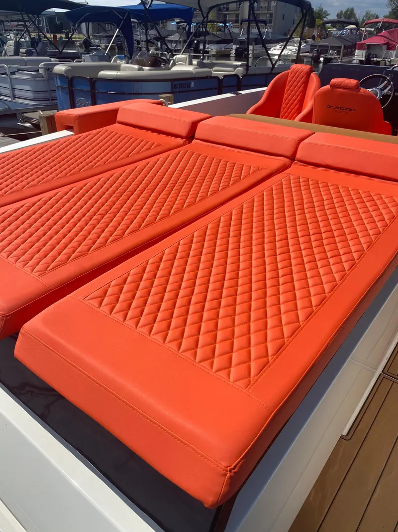 Slide: The Image of 2020 De Antonio Yachts D 28 with orange quilted sunbeds. - 38