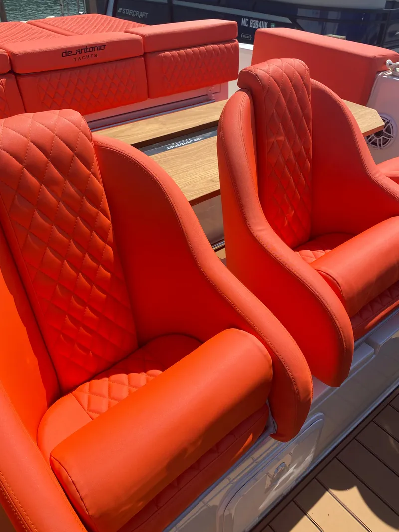 Slide: The Image of Bright orange seats on a 2020 De Antonio Yachts D 28 boat. - 46