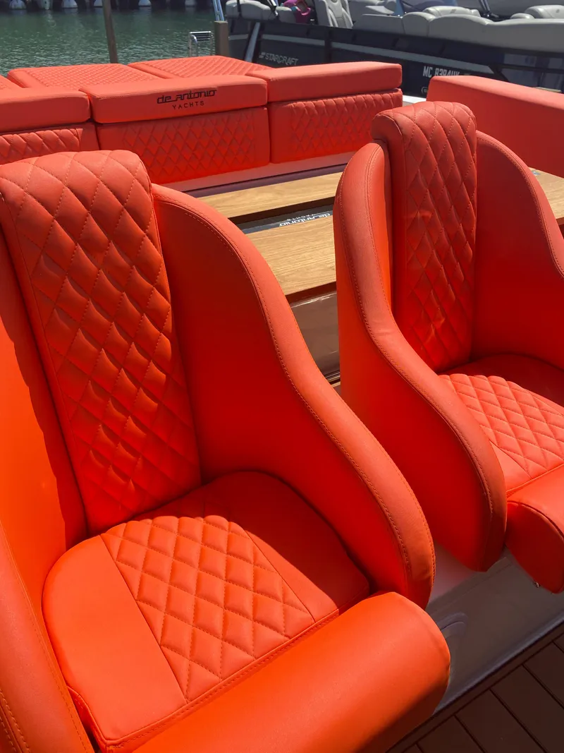 Slide: The Image of Bright orange seats on a 2020 De Antonio Yachts D 28 model. - 47
