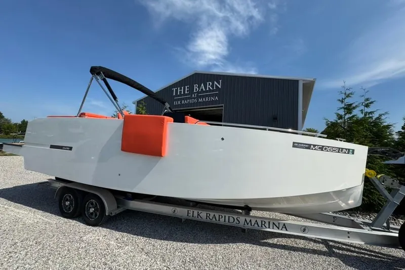 Slide: The Image of 2020 De Antonio Yachts D28 on trailer at Elk Rapids Marina, clear sky background. - 55